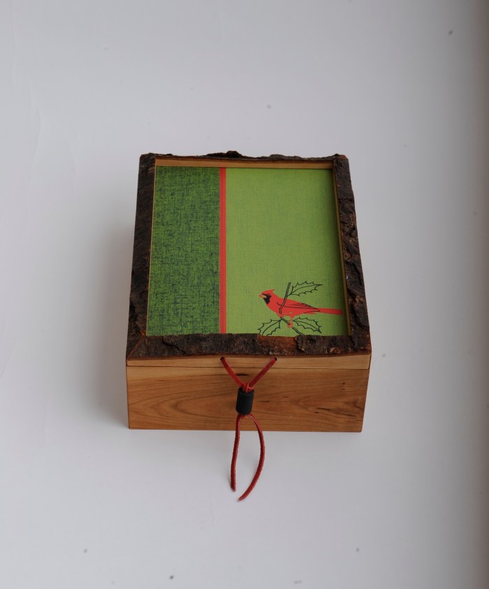 Live-edge cherry box with recycled book cover as top and bottom panel. $80.00