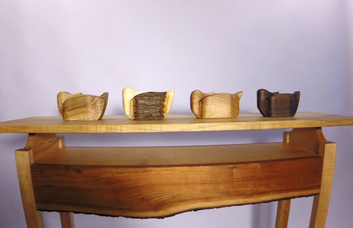 Carved duck boxes with secret drawer full of matches.